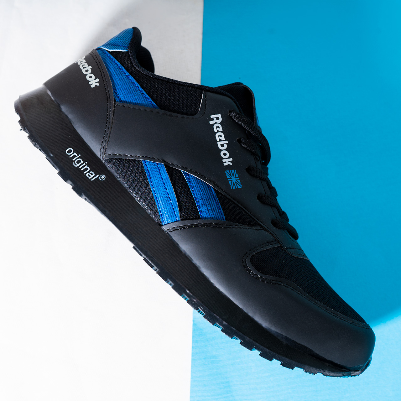 کفش ورزشی Reebok مشکی آبی مردانه مدلRako